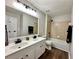 Well-lit bathroom featuring a double vanity with a shower and bathtub at 608 Chickory Ct, Woodstock, GA 30188