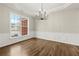 Dining room with chandelier, and large window allowing plenty of natural light at 608 Chickory Ct, Woodstock, GA 30188