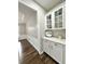Butler's pantry features white cabinets and counters at 608 Chickory Ct, Woodstock, GA 30188