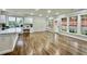 Spacious open kitchen with lots of natural light, white cabinetry, and luxury vinyl plank flooring throughout at 608 Chickory Ct, Woodstock, GA 30188