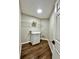 Functional laundry room with modern cabinets and ample counter space for convenience at 608 Chickory Ct, Woodstock, GA 30188