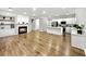 Bright and airy living room with modern fireplace, built-in shelving, and luxury vinyl plank flooring at 608 Chickory Ct, Woodstock, GA 30188