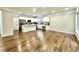 Open-concept kitchen and living area with hardwood floors and recessed lighting at 608 Chickory Ct, Woodstock, GA 30188