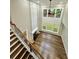 Bright living room featuring two story ceilings and hardwood style flooring with plenty of natural light at 608 Chickory Ct, Woodstock, GA 30188