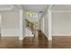 Open living space with stairway and tall windows providing ample natural light at 608 Chickory Ct, Woodstock, GA 30188
