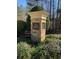 Stone sign for the Nature Trail community nestled among greenery at 608 Chickory Ct, Woodstock, GA 30188