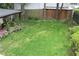 Overhead view of a lush green backyard with manicured lawn and privacy fence surrounded by trees and shrubs at 728 Antone Nw St, Atlanta, GA 30318
