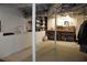 Basement area with work table and shelves, painted walls and ceilings, ideal for hobbies at 728 Antone Nw St, Atlanta, GA 30318