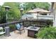 Outdoor deck with comfortable seating, heater, and umbrella, creating a cozy entertaining space at 728 Antone Nw St, Atlanta, GA 30318