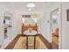 Bright hallway with hardwood floors, art and access to a bedroom and living areas at 728 Antone Nw St, Atlanta, GA 30318