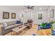 Bright living room with neutral walls, ceiling fan, and comfortable seating arrangement at 728 Antone Nw St, Atlanta, GA 30318