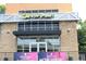 Exterior of Cafe At Pharr, with a 'Now Hiring' banner for La Mixteca Tamale House at 728 Antone Nw St, Atlanta, GA 30318