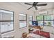 Bright sunroom with tile flooring, home office setup, and a ceiling fan for added comfort at 728 Antone Nw St, Atlanta, GA 30318