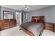 Bedroom with full size bed and matching bedside tables at 1340 Gran Forest Dr, Cumming, GA 30041