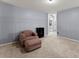 Spacious bedroom featuring a cozy chair and ottoman at 1340 Gran Forest Dr, Cumming, GA 30041