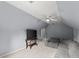 Bonus room featuring a large sectional couch, tv, and ceiling fan at 1340 Gran Forest Dr, Cumming, GA 30041