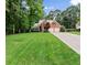 Traditional brick home with well-kept lawn, offering a glimpse of comfortable suburban living at 1340 Gran Forest Dr, Cumming, GA 30041