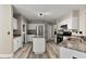 Open-concept kitchen featuring stainless appliances, granite counters, an island, and plenty of cabinet space at 1340 Gran Forest Dr, Cumming, GA 30041