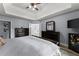 Open main bedroom features a large bed, dual closets, and a window view to the outdoors at 1340 Gran Forest Dr, Cumming, GA 30041