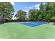 Community tennis courts offer well-maintained playing surfaces and manicured landscaping at 1340 Gran Forest Dr, Cumming, GA 30041