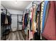 Walk-in closet with metal racks and ample storage space for hanging clothes, shoes, and baskets at 1340 Gran Forest Dr, Cumming, GA 30041