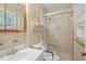 This is a bathroom with a shower, toilet, and sink with floral wallpaper at 1960 Oak Leaf Sw Ct, Marietta, GA 30008