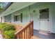Inviting front porch with brick accents, offering a warm welcome to guests at 1960 Oak Leaf Sw Ct, Marietta, GA 30008