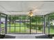 This is a screened patio with a ceiling fan and a view of the backyard at 1960 Oak Leaf Sw Ct, Marietta, GA 30008
