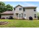 Exterior back view showing a large backyard with a patio, lawn and grill at 4424 English Loop, Stonecrest, GA 30038