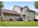 A spacious backyard featuring a well-maintained lawn and a two-story vinyl sided home with ample outdoor space at 4424 English Loop, Stonecrest, GA 30038