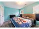 Neutral bedroom with light blue walls, neutral carpet, and a double window at 4424 English Loop, Stonecrest, GA 30038