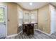 Cozy dining area with bright natural light and wood-look flooring, perfect for casual meals at 4424 English Loop, Stonecrest, GA 30038