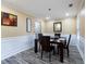 Classic dining room featuring elegant wainscoting, hardwood floors, and stylish decor at 4424 English Loop, Stonecrest, GA 30038