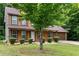 Well-kept two-story home with lush landscaping, a spacious front yard, and a driveway at 4424 English Loop, Stonecrest, GA 30038