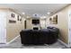 Modern living room with a large leather sofa, fireplace, and neutral walls, creating a comfortable space at 4424 English Loop, Stonecrest, GA 30038
