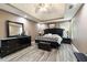 Spacious main bedroom features a tray ceiling, an accent wall, and neutral paint at 4424 English Loop, Stonecrest, GA 30038