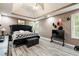 Spacious main bedroom with tray ceiling and a statement headboard at 4424 English Loop, Stonecrest, GA 30038