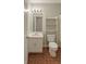 Clean bathroom featuring a white vanity and a toilet with storage at 45 Avery Drive, Covington, GA 30016