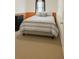 Neutral bedroom featuring a queen bed and dresser at 45 Avery Drive, Covington, GA 30016
