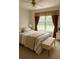 Serene bedroom featuring a queen bed, neutral tones, and a bright window view at 45 Avery Drive, Covington, GA 30016