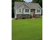 Charming two-story home with a well-manicured front yard and a welcoming entrance at 45 Avery Drive, Covington, GA 30016