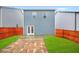 Well-maintained backyard with green grass, privacy fence, and a stone patio for outdoor enjoyment at 826 Bentley Dr, Fairburn, GA 30213