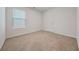 Bedroom with natural light from window and neutral carpeting at 826 Bentley Dr, Fairburn, GA 30213