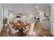Elegant dining area adjacent to kitchen offering open views, seating for six, and stylish decor at 826 Bentley Dr, Fairburn, GA 30213