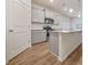 Bright kitchen features stainless steel appliances, granite countertops, and an island, perfect for modern living at 826 Bentley Dr, Fairburn, GA 30213