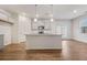 Spacious kitchen offers an island with a sink, ample countertops, and a door that leads to the backyard at 826 Bentley Dr, Fairburn, GA 30213