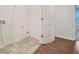 Laundry room with space for appliances and storage, plus mixed flooring at 826 Bentley Dr, Fairburn, GA 30213