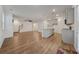 Open-concept living space featuring hardwood floors and kitchen with stainless steel appliances at 826 Bentley Dr, Fairburn, GA 30213