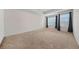 Spacious main bedroom featuring large windows with draperies, offering plenty of natural light and comfort at 826 Bentley Dr, Fairburn, GA 30213