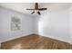 Cozy bedroom with hardwood floors and a large window at 957 Sharon Se Cir, Smyrna, GA 30080